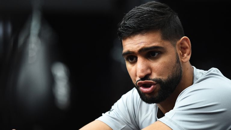 BOLTON, ENGLAND - JUNE 19: Amir Khan talks to the press before he takes part during a training session at Amir Khan Academy on June 19, 2019 in Bolton, England. (Photo by Nathan Stirk/Getty Images)