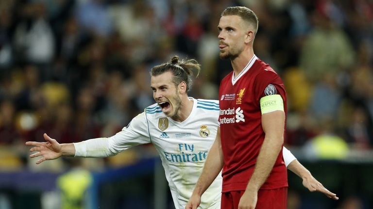 Gareth Bale celebrates as Henderson watches on during Real Madrid&#39;s Champions League final victory over Liverpool in 2018