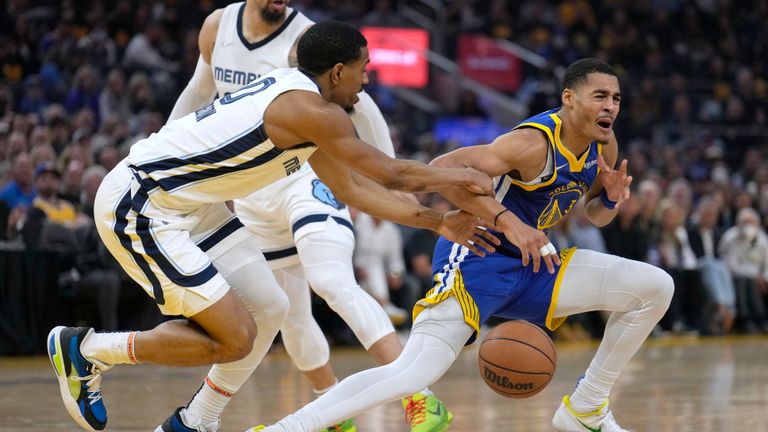 Memphis Grizzlies guard De&#39;Anthony Melton, left, steals the ball from Golden State Warriors guard Jordan Poole during the first half of Game 6 of an NBA basketball Western Conference playoff semifinal in San Francisco, Friday, May 13, 2022.