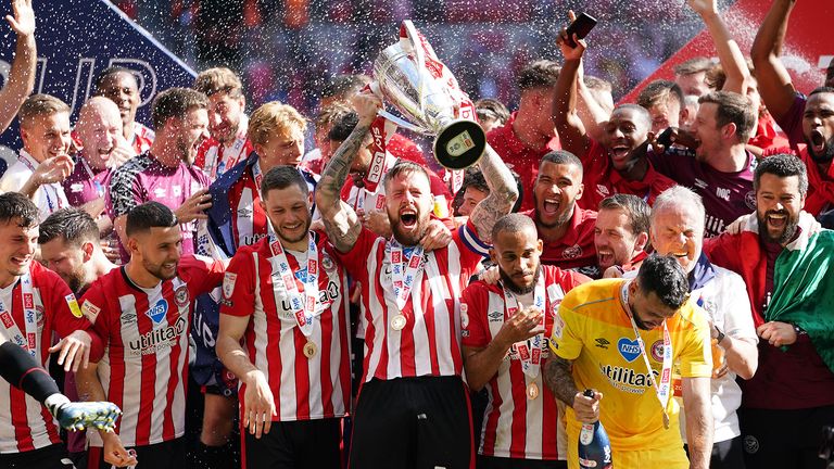 Brentford with the trophy, after being promoted to the Premier League