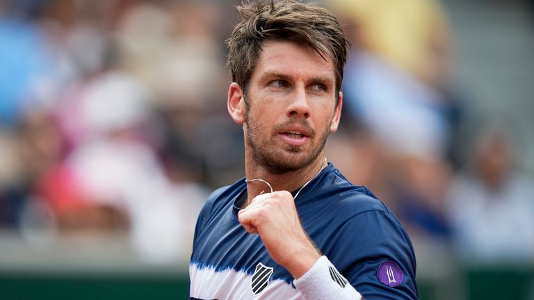 Britain's Cameron Norrie clenches his fist after scoring a point against France's Manuel Guinard during their first round match at the French Open tennis tournament in Roland Garros stadium in Paris, France, Monday, May 23, 2022. (AP Photo/Michel Euler)