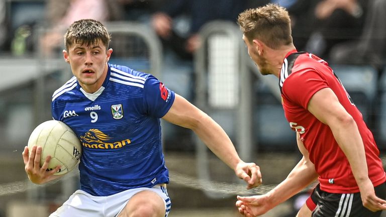 28 May 2022; James Smith of Cavan in action against Adam Lynch of Down during the Tailteann Cup Round 1 match between Cavan and Down at Kingspan Breffni in Cavan. Photo by Oliver McVeigh/Sportsfile