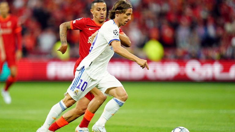Real Madrid&#39;s Luka Modric tries to get away from Liverpool&#39;s Thiago Alcantara
