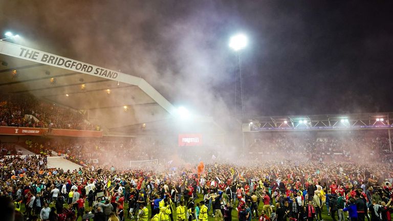 The pitch at the City Ground was invaded after Nottingham Forest sealed their place in the Championship play-off final