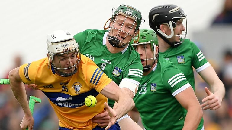 15 May 2022; Ryan Taylor of Clare is tackled by William O'Donogue of Limerick during the Munster GAA Hurling Senior Championship Round 4 match between Clare and Limerick at Cusack Park in Ennis, Clare. Photo by Ray McManus/Sportsfile
