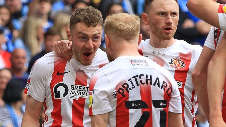 Elliot Embleton is mobbed by his team-mates after firing Sunderland in front against Wycombe