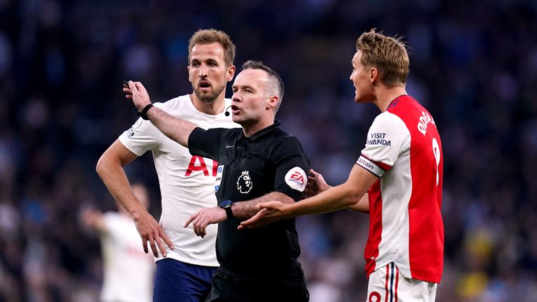 Referee Paul Tierney waves away protests from Arsenal&#39;s Martin Odegaard, (right) during the Premier League match at Tottenham Hotspur Stadium, London. 
