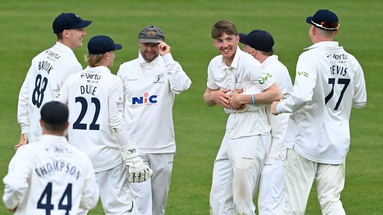 George Hill of Yorkshire celebrates with his team-mates after dismissing Kent's George Linde 