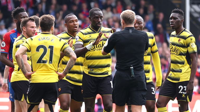 Hassane Kamara pleads his case to referee Graham Scott before receiving a red card