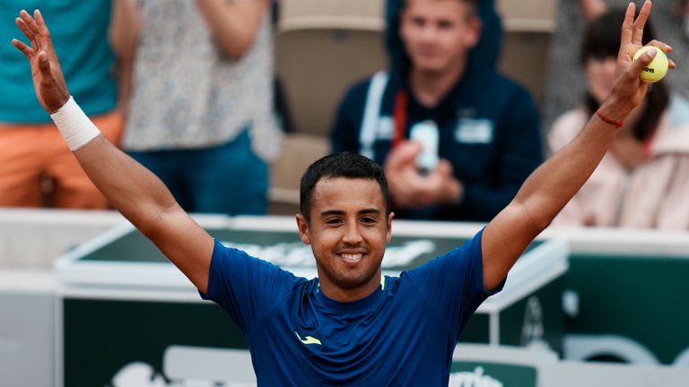 Bolivia's Hugo Dellien celebrates defeating Austria's Dominic Thiem in the first round of the French Open