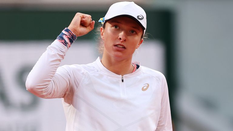 Iga Swiatek of Poland celebrates match point against Qinwen Zheng of China during the Women's Singles Fourth Round match on Day 9 of The 2022 French Open at Roland Garros on May 30, 2022 in Paris, France. (Photo by Ryan Pierse/Getty Images)