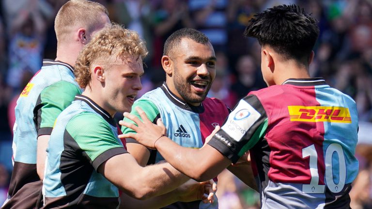 Harlequins Joe Marchant (centre) celebrates scoring his side's third try with teammates during the Heineken Champions Cup round of 16, second leg match at the Twickenham Stoop, London. Picture date: Saturday April 16, 2022.