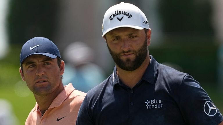 From right, Jon Rahm, of Spain, Scottie Scheffler and Collin Morikawa walk off the green on the fourth hole during the first round of the PGA Championship golf tournament at Southern Hills Country Club, Thursday, May 19, 2022, in Tulsa, Okla. (AP Photo/Matt York)