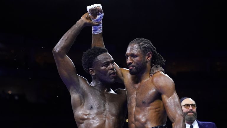 Joshua Buatsi (left) celebrates his victory against Craig Richards in their WBA light-heavyweight world title eliminator 