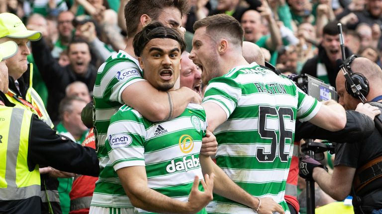 Jota celebrates with his Celtic team-mates after scoring to make it 1-0