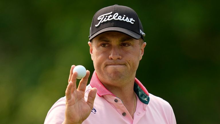 Justin Thomas waves after making a putt on the 14th hole during the final round of the PGA Championship