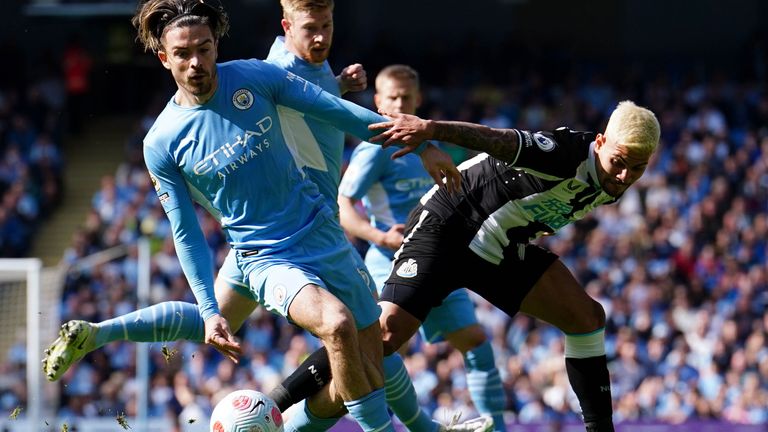 Manchester City&#39;s Jack Grealish (left) and Newcastle United&#39;s Bruno Guimaraes battle for the ball during the Premier League match at the Etihad Stadium, Manchester. Picture date: Sunday May 8, 2022.