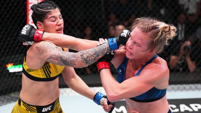 Ketlen Vieira of Brazil and Holly Holm trade punches in a bantamweight bout during the UFC Fight Night event in Las Vegas
