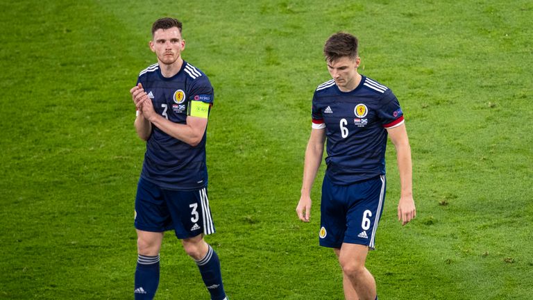 GLASGOW, SCOTLAND - JUN 22: Scotland captain Andy Robertson (left) full time with Kieran Tierney during the Euro 2020 match between Croatia and Scotland at Hampden Park on June 22, 2021 in Glasgow, Scotland.  (Photo by Ross Parker/SNS Group)