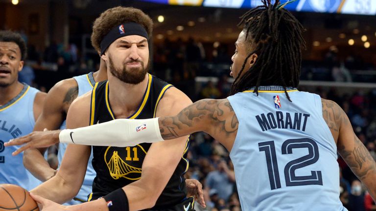 Klay Thompson is defended by Ja Morant during the regular season