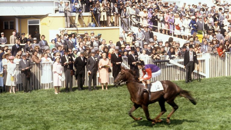 The Queen watches as Piggott rides her horse Milford at the Derby meeting at Epsom 