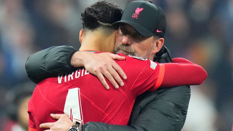 Liverpool manager Jurgen Klopp embraces Virgil van Dijk after the Champions League final