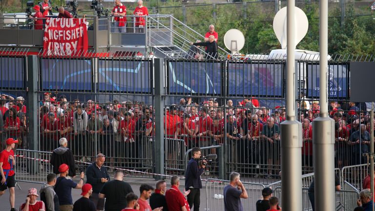 Liverpool fans queue to gain entry to the stadium ahead of the Champions League final
