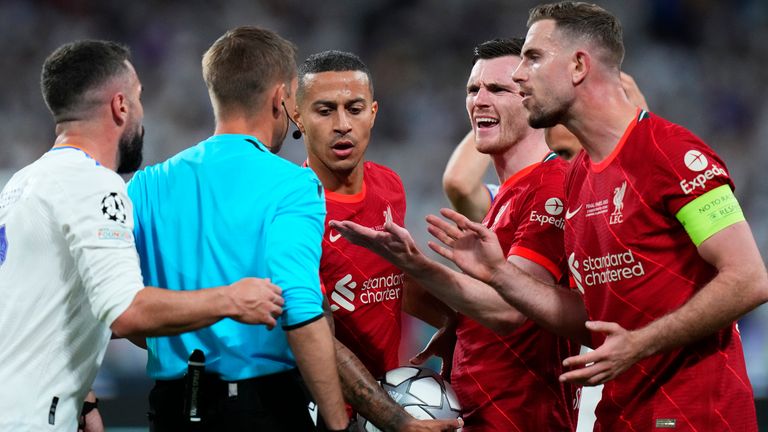 Liverpool players complain to the referee during the Champions League final soccer match between Liverpool and Real Madrid at the Stade de France in Saint Denis near Paris, Saturday, May 28, 2022. (AP Photo/Petr David Josek)