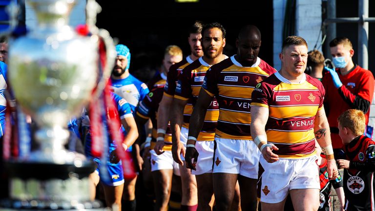 Picture by Alex Whitehead/SWpix.com - 27/03/2022 - Rugby League - Betfred Challenge Cup: Round Six - Barrow Raiders vs Huddersfield Giants - Matt Johnson Prestige Stadium, Barrow-in-Furness, England - Huddersfield captain Luke Yates leads his side out.