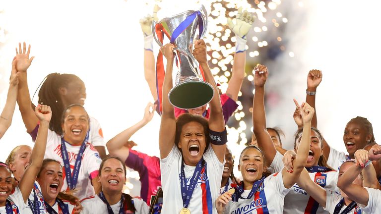 Lyon captain Wendie Renard lifts the Women's Champions League trophy aloft  