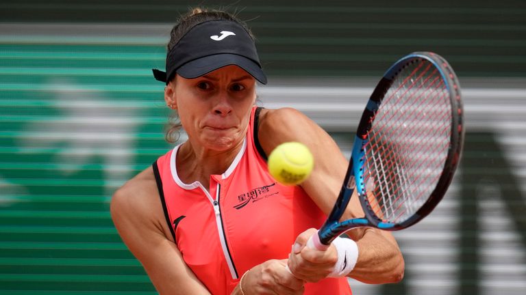 Poland's Magda Linette plays a shot against Tunisia's Ons Jabeur during their first round match at the French Open