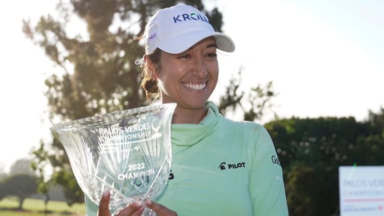 Marina Alex celebrates with the trophy after winning the Palos Verdes Championship in California