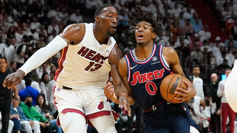 Philadelphia 76ers guard Tyrese Maxey drives to the basket as Miami Heat center Bam Adebayo defends, during the first half of Game 2 of an NBA basketball second-round playoff series, Wednesday, May 4, 2022, in Miami.