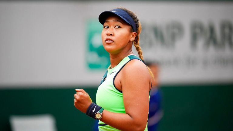 Japan's Naomi Osaka clenches her fist after scoring a point against Amanda Anisimova of the U.S. during their first round match at the French Open tennis tournament in Roland Garros stadium in Paris, France, Monday, May 23, 2022. (AP Photo/Christophe Ena)
