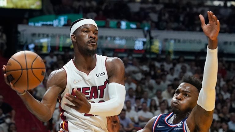 Miami Heat forward Jimmy Butler looks to pass the ball as Philadelphia 76ers forward Paul Reed defends during the second half of Game 2 of an NBA basketball second-round playoff series, Wednesday, May 4, 2022, in Miami. 