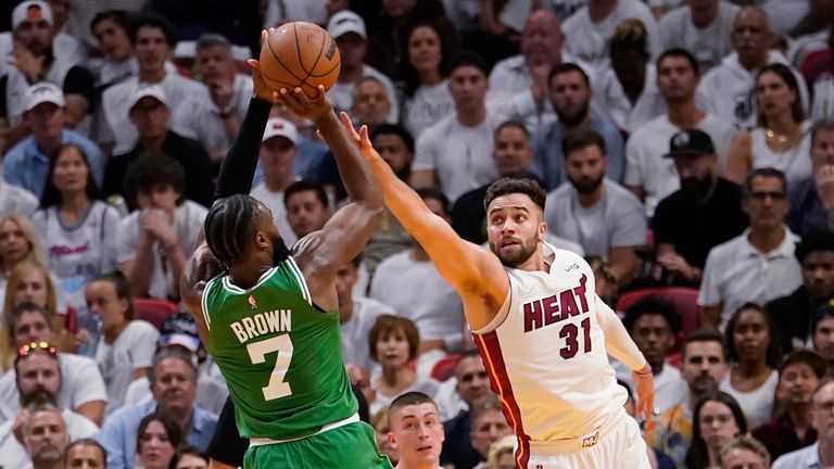 Miami Heat guard Max Strus (31) defends Boston Celtics guard Jaylen Brown (7) during the first half of Game 1 of an NBA basketball Eastern Conference finals playoff series