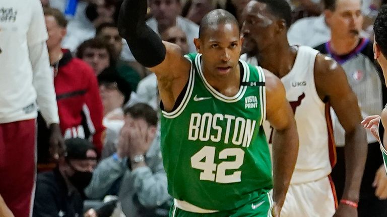 Boston Celtics center Al Horford (42) gestures after scoring during the first half of Game 7 of the NBA basketball Eastern Conference finals playoff series against the Miami Heat, Sunday, May 29, 2022, in Miami. 