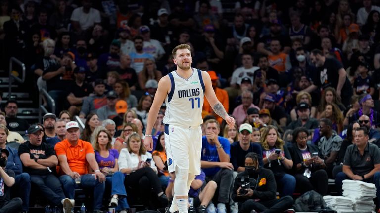 Dallas Mavericks guard Luka Doncic smiles after making a basket against the Phoenix Suns during the second half of Game 7 of an NBA basketball Western Conference playoff semifinal, Sunday, May 15, 2022, in Phoenix. The Mavericks defeated the Suns 123-90. 