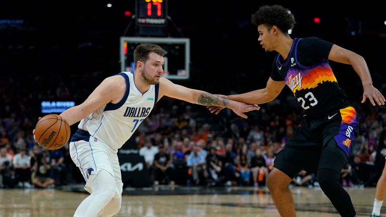 Dallas Mavericks guard Luka Doncic drives to the basket against Phoenix Suns forward Cameron Johnson during the first half of Game 2 in the second round of the NBA Western Conference playoff series Wednesday, May 4, 2022, in Phoenix. 