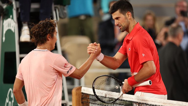 Novak Djokovic of Serbia greets Yoshihito Nishioka of Japan at the net after the Men's Singles First Round match at Roland Garros on May 23, 2022 in Paris, France. (Photo by Adam Pretty/Getty Images)