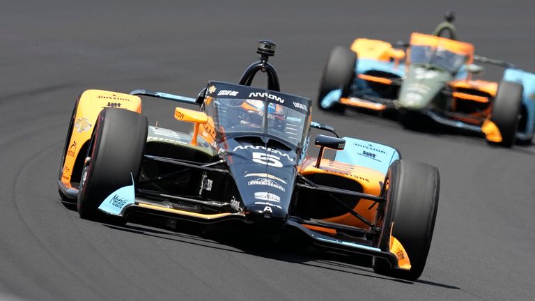 Pato O'Ward, of Mexico, drives into the first turn during the Indianapolis 500 auto race at Indianapolis Motor Speedway, Sunday, May 29, 2022, in Indianapolis. (AP Photo/Darron Cummings)