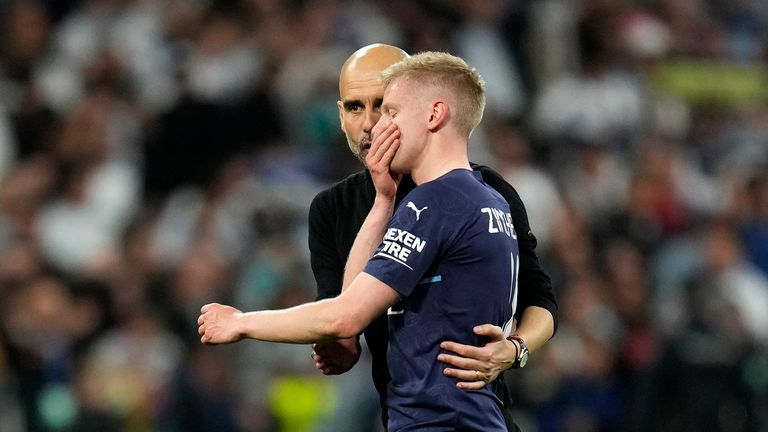 Manchester City&#39;s head coach Pep Guardiola speaks with Manchester City&#39;s Oleksandr Zinchenko at the end of the Champions League semi final
