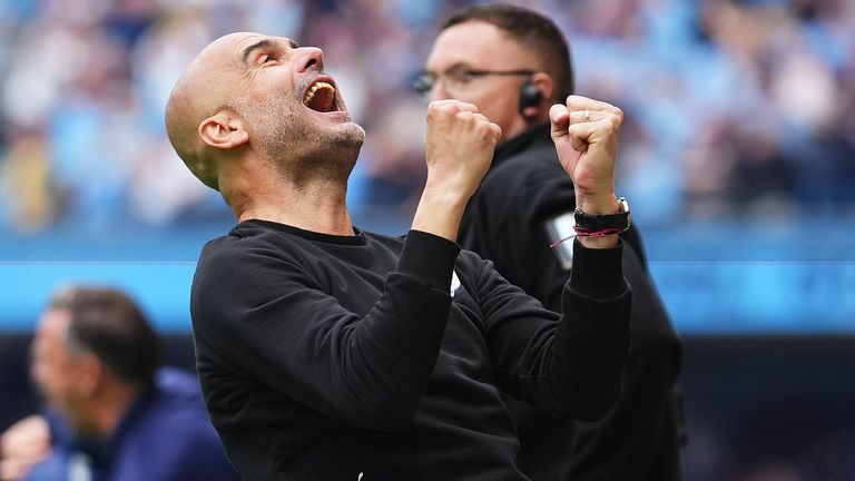 Pep Guardiola merayakan setelah Manchester City menyegel gelar Liga Premier