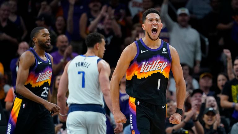 Phoenix Suns guard Devin Booker (1) celebrates a score against the Dallas Mavericks during the first half of Game 1 in the second round of the NBA Western Conference playoff series Monday, May 2, 2022, in Phoenix.