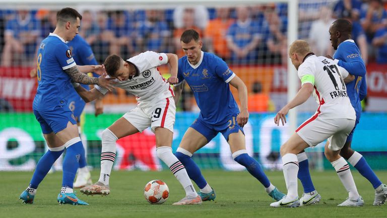 Jesper Lindstroem of Eintracht Frankfurt battles for possession with Brandon Barker of Rangers