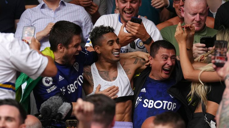 Raphinha celebrates Premier League survival with Leeds fan at Brentford