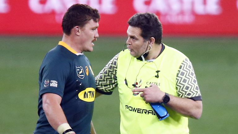 South Africa boss Rassie Erasmus (right) courted controversy by acting as a water carrier during last summer's Lions tour