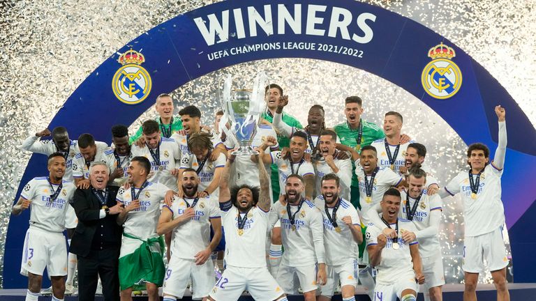 Real Madrid's Marcelo lifts the trophy after winning the Champions League final between Liverpool and Real Madrid at the Stade de France 