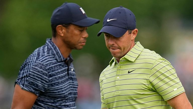 Rory McIlroy, of North Ireland, and Tiger Woods walk on the 11th green during the first round of the PGA Championship golf tournament, Thursday, May 19, 2022, in Tulsa, Okla. (AP Photo/Eric Gay)