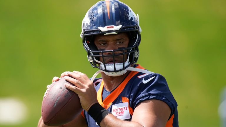 Denver Broncos quarterback Russell Wilson takes part in drills during a voluntary veteran minicamp football